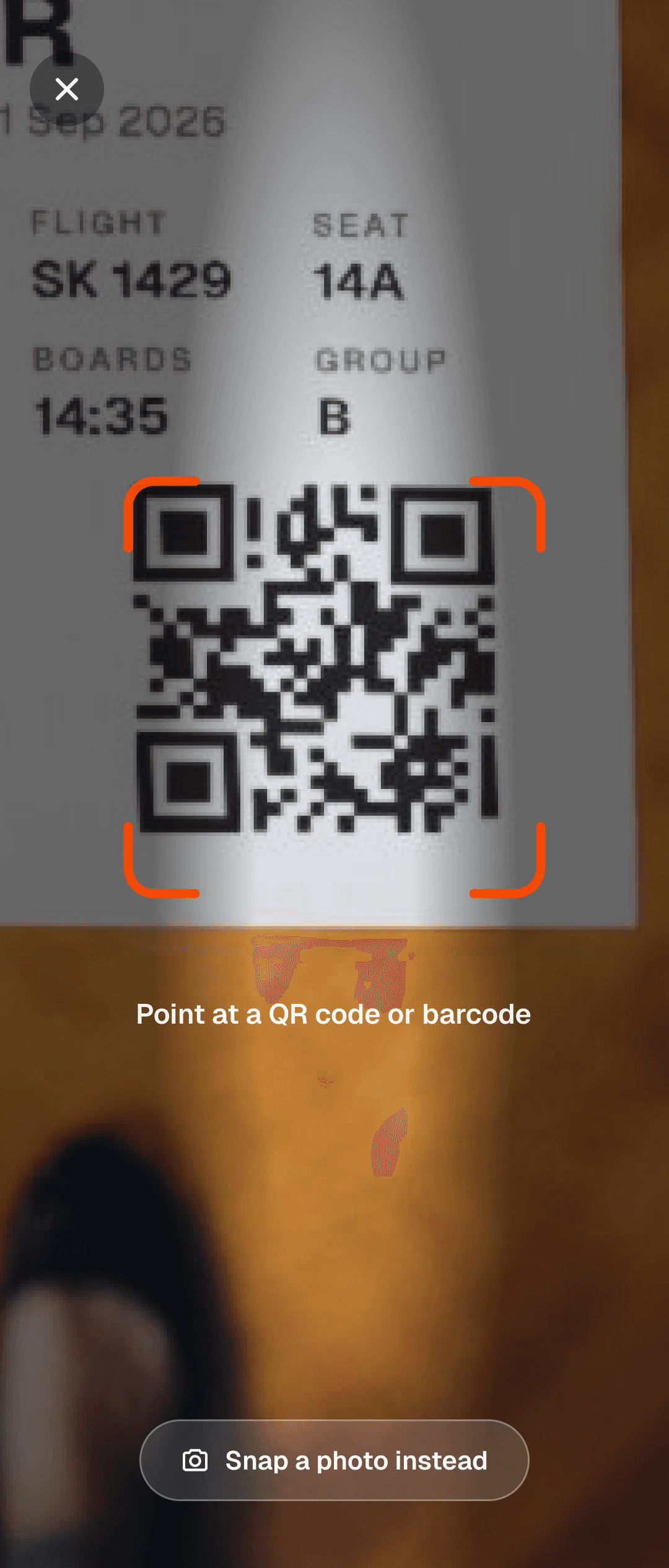 Walt's live camera scanner framing the QR code on a boarding pass